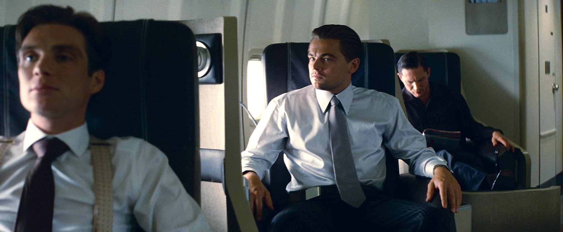 Dom Cobb in a suit during a tense moment of the dream heist