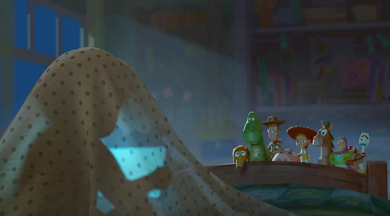 Pixar toys walking through rows of screens